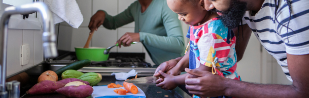 man and child learning to chop vegetables for a keto meal in the kitchen-ketosis-ketogenic-keto diet-keto bread-keto diet foods-keto recipes-keto snacks-keto meals-keto breakfast ideas-keto dinner