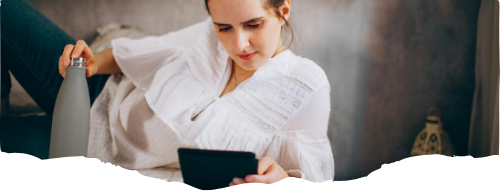 woman laying down while viewing her tablet-keto-ketosis-ketogenic-keto diet-healthy recipes-free keto recipes-1